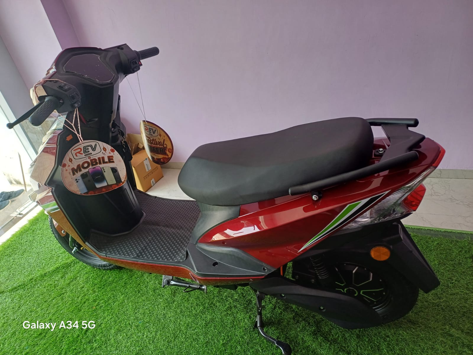 REV EON electric scooter in red, side view